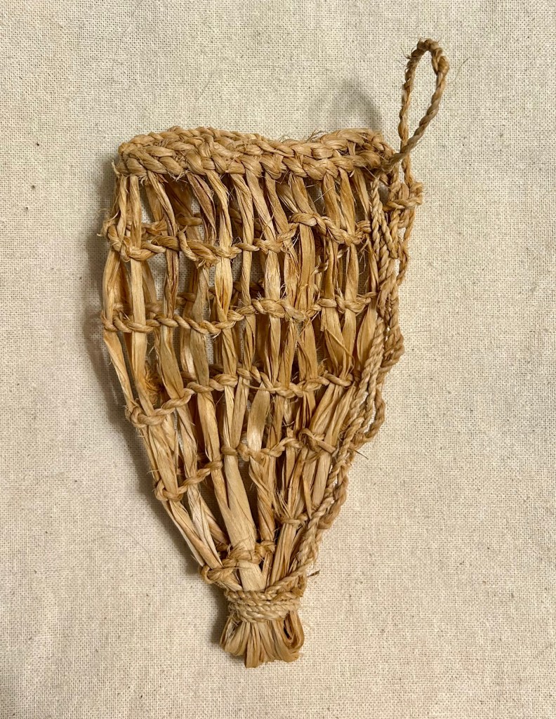 Replica dagger sheath made with lime bast after the surviving Chalcolithic artefact found with Ötzi's the Ice Man. Side 1. 